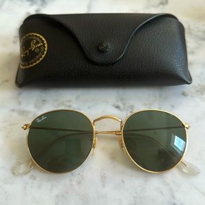 Ray Ban. Round polished gold sunglasses